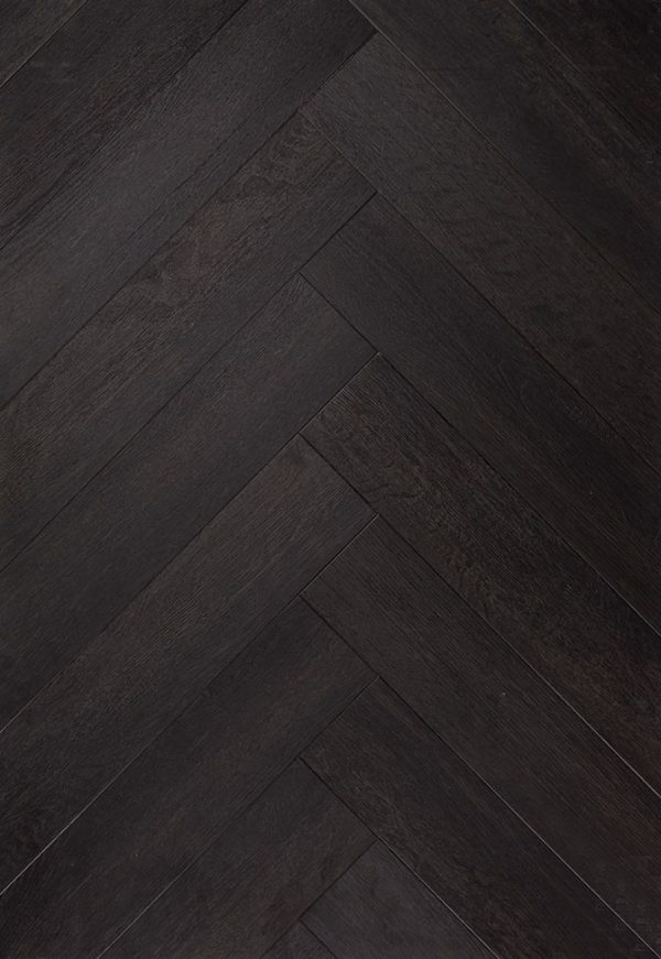 The Ossis 5 herringbone PVC floor allows you to create a sense of dynamism in any space. The dark pattern ensures a timeless and luxurious look in your interior.